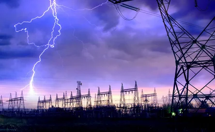 Dramatic Image of Power Distribution Station with Lightning Striking Electricity Towers.