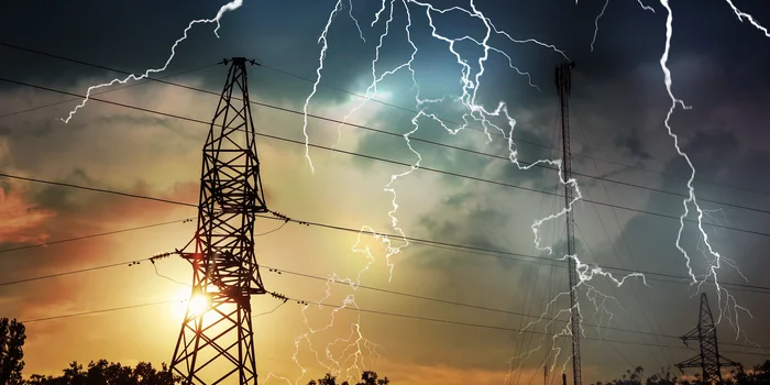 Picturesque lightning storm over high voltage towers