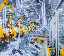 robotic arms in a car plant